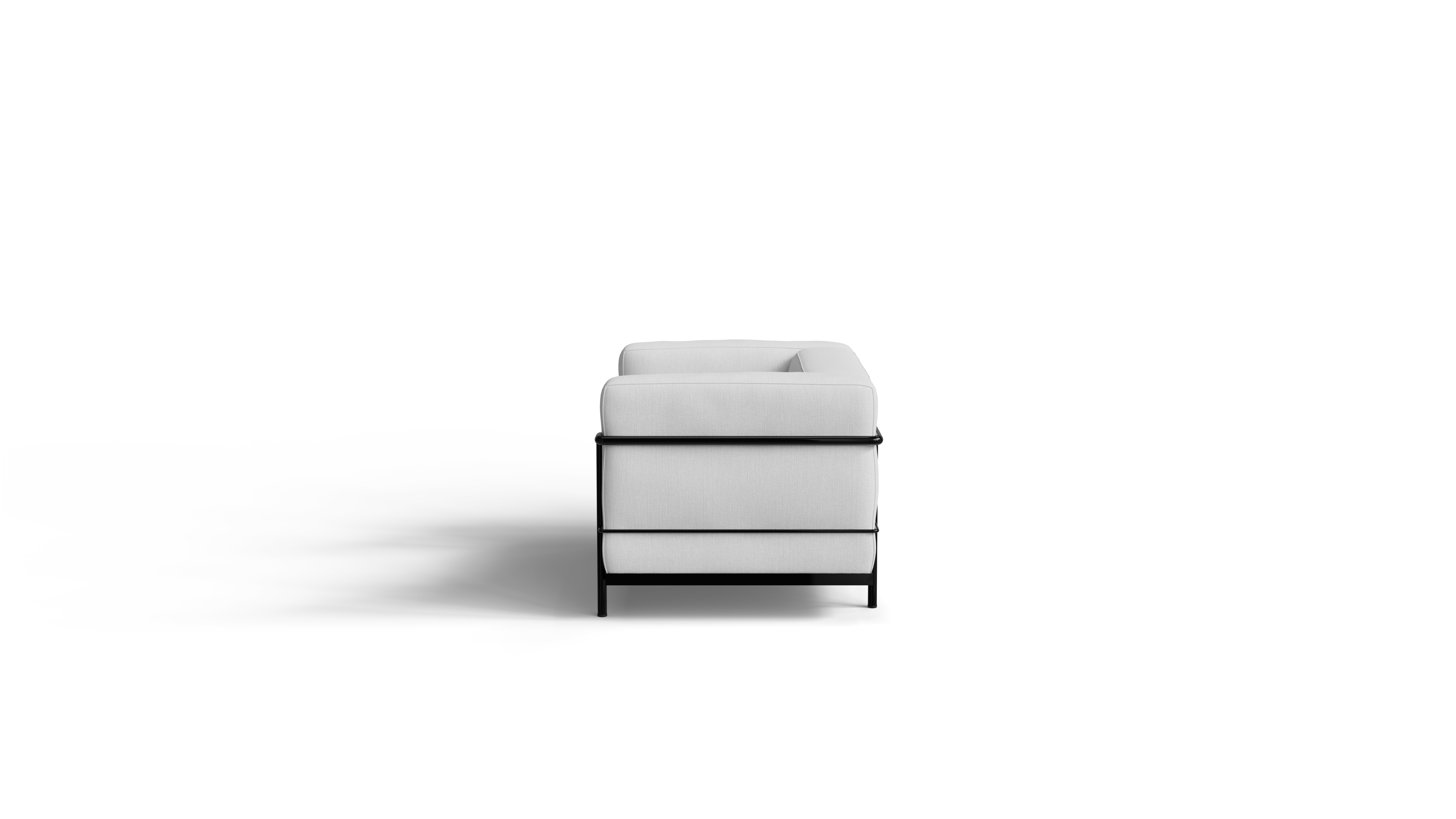 White Le Corbusier LC3 armchair with black frame on a white background, side view