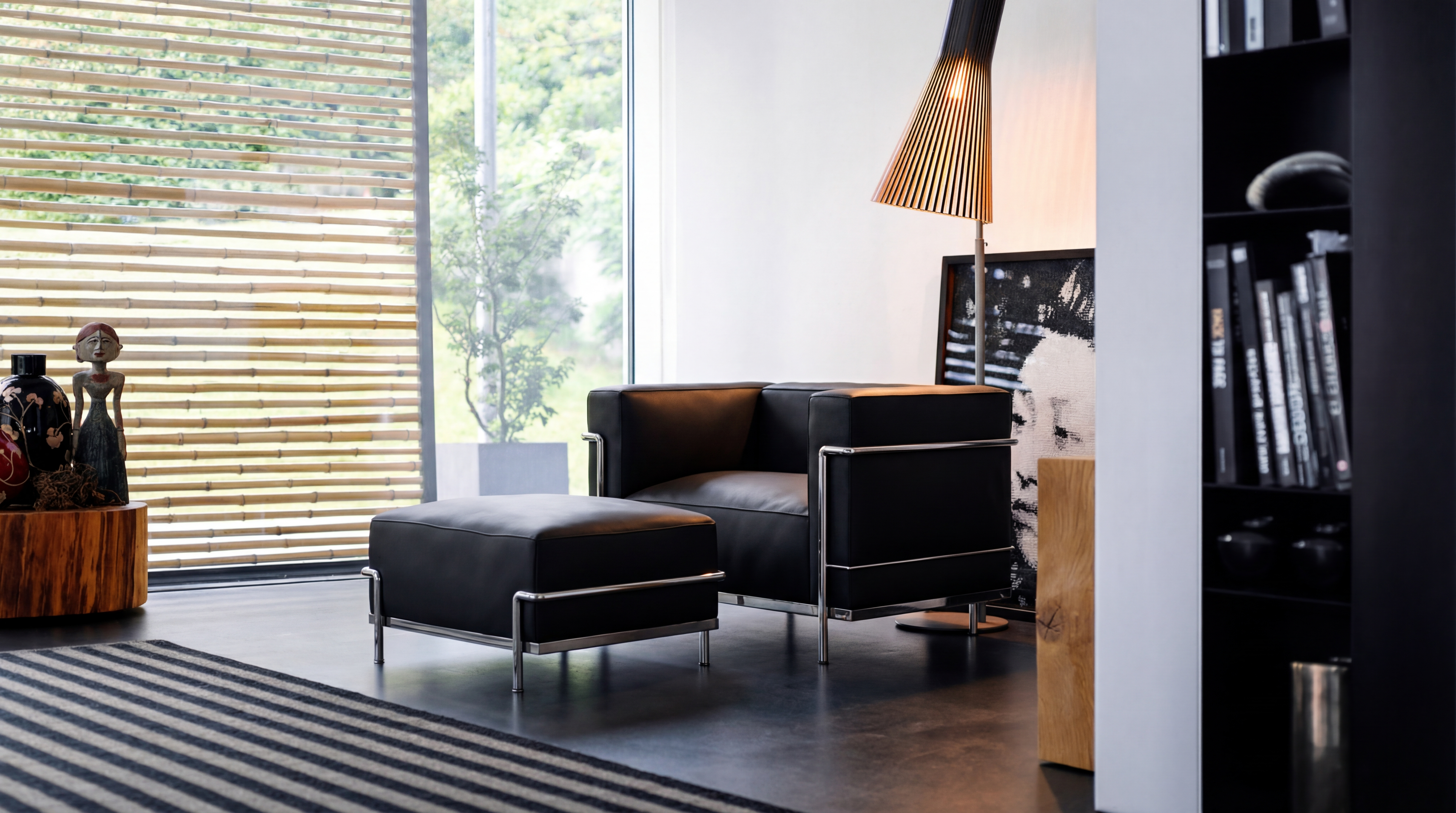 Le Corbusier LC3 down feather Armchair reproduction with a LC2 | LC3 Ottoman in a modern sitting room - USA Hero Image