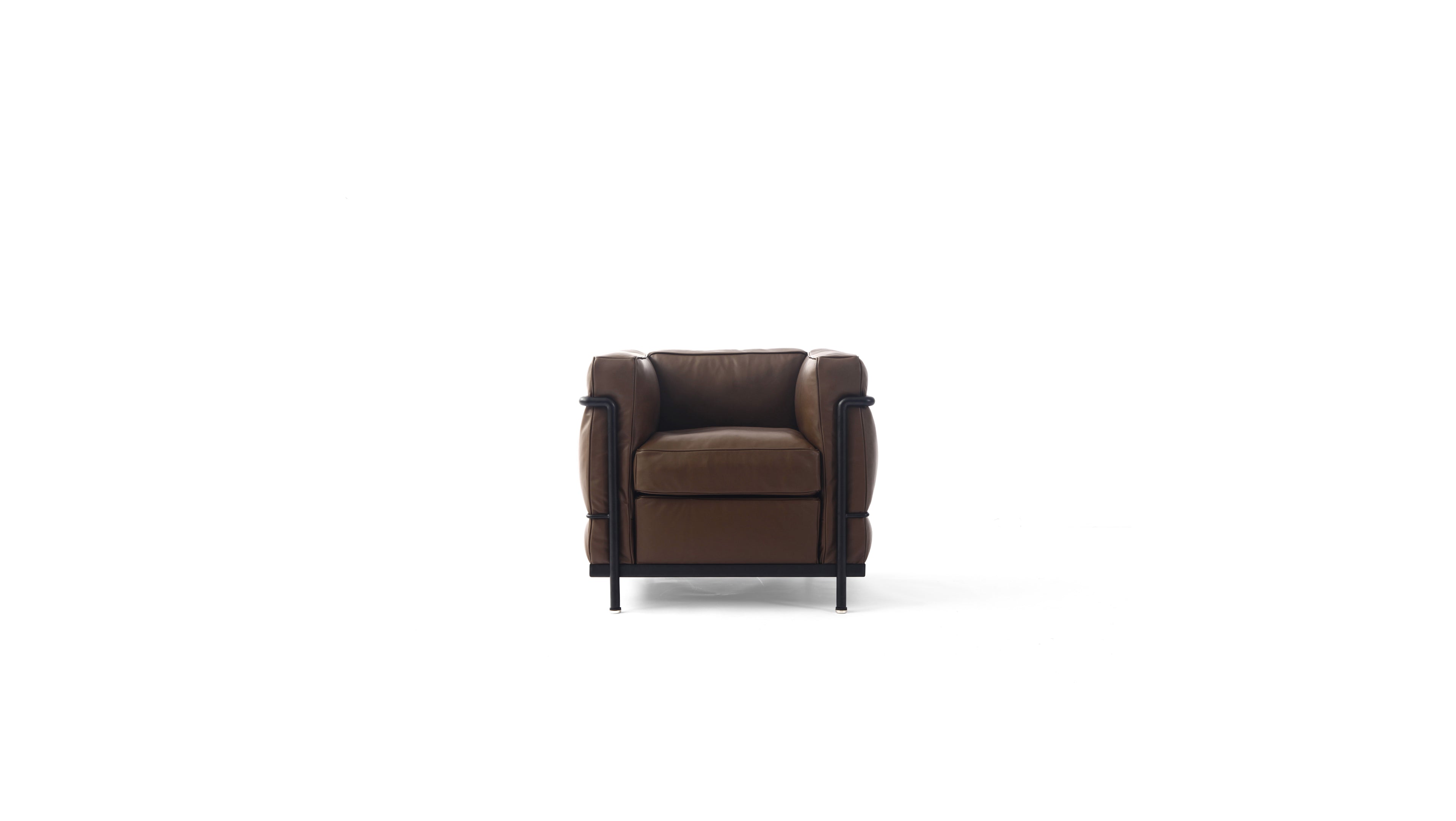 A modern brown leather LC2 armchair with a black metal frame and legs, shown from a front angle on a solid white background.