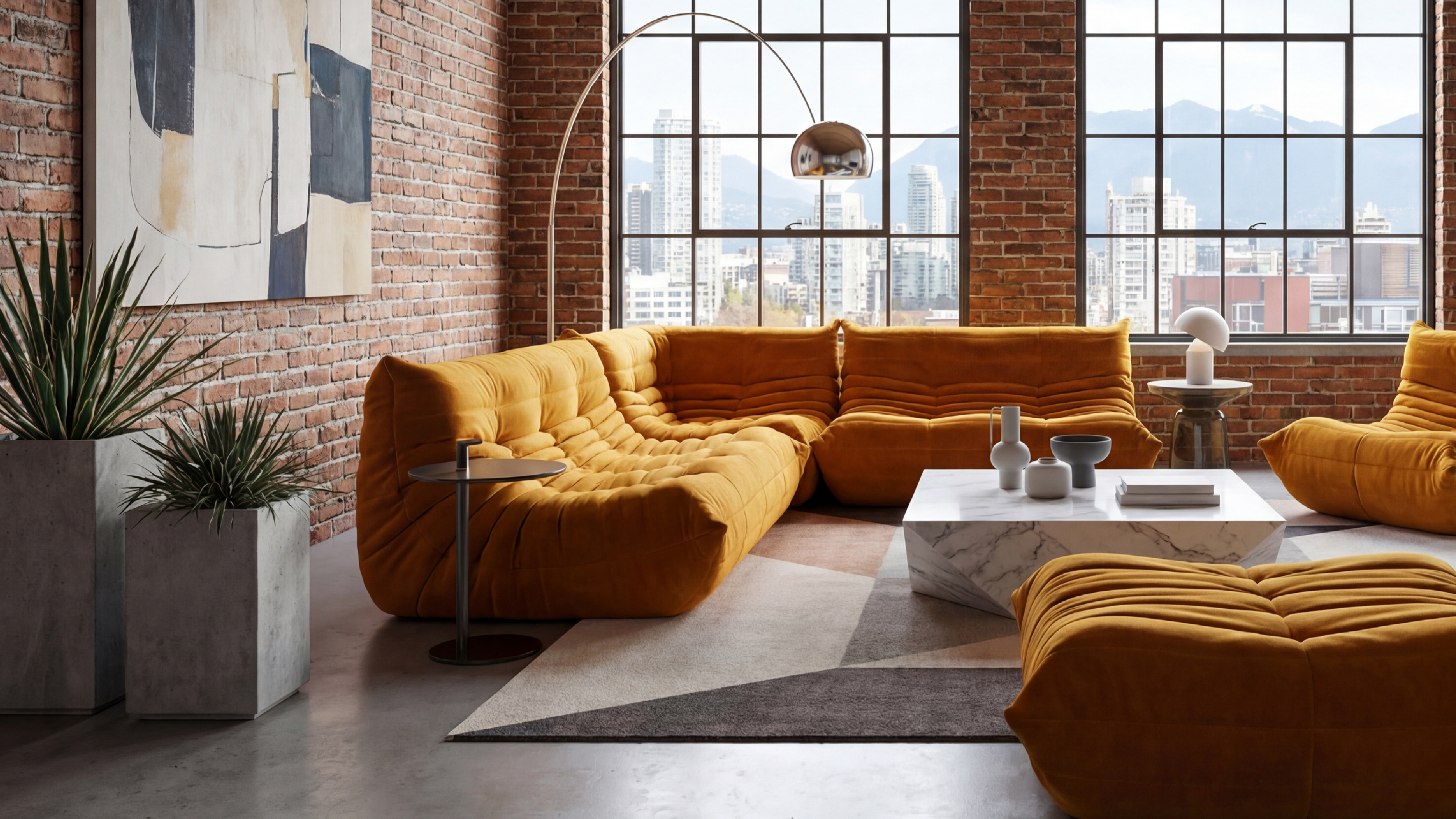 Modern living room with yellow Michel Ducaroy TOGO Corner Seat in the USA in Canada R 3233 rep, marble coffee table, and large windows with cityscape view. Desktop Hero