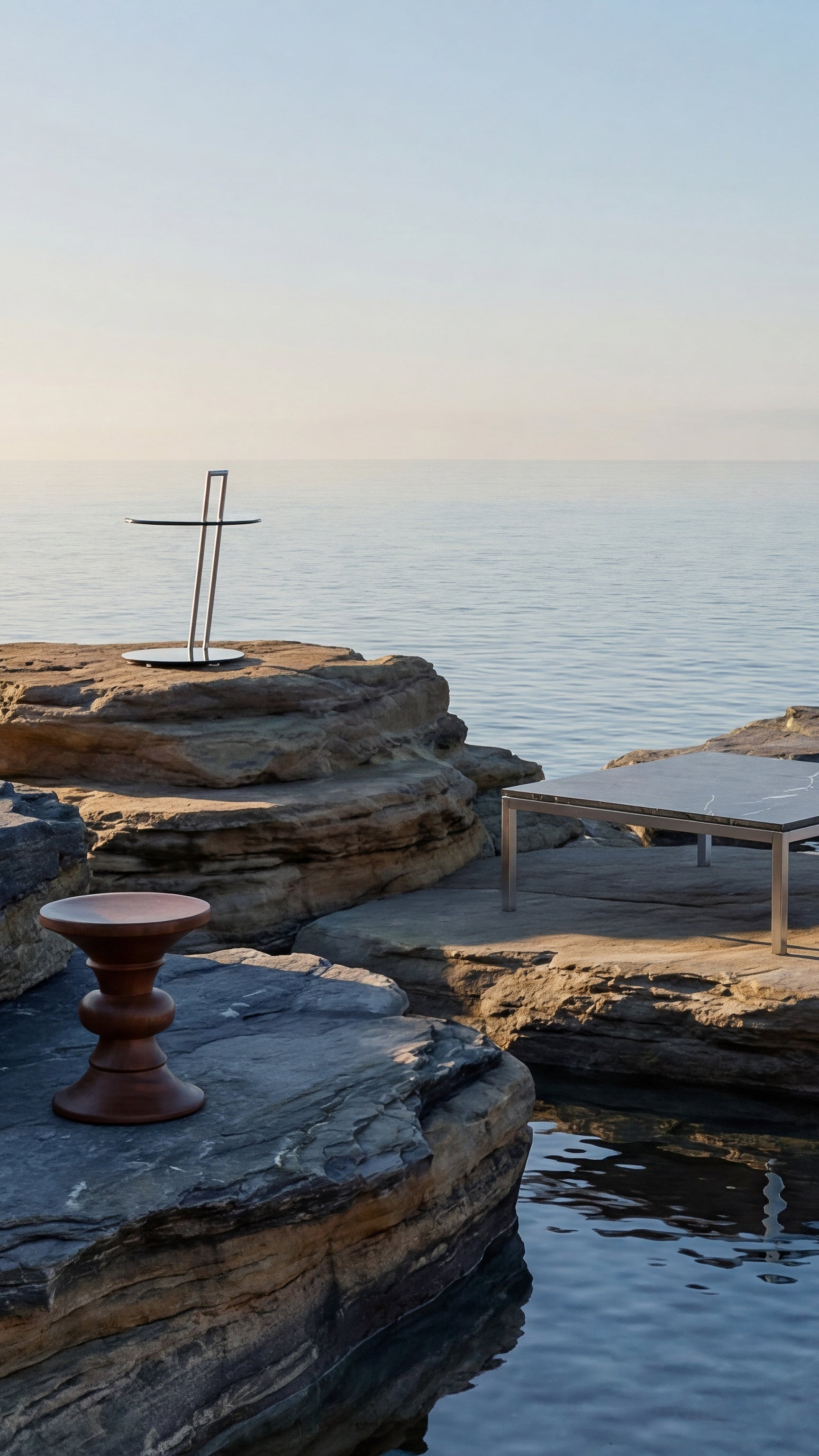 Modern furniture on rocky coastal area with ocean view - Mobile Hero 2