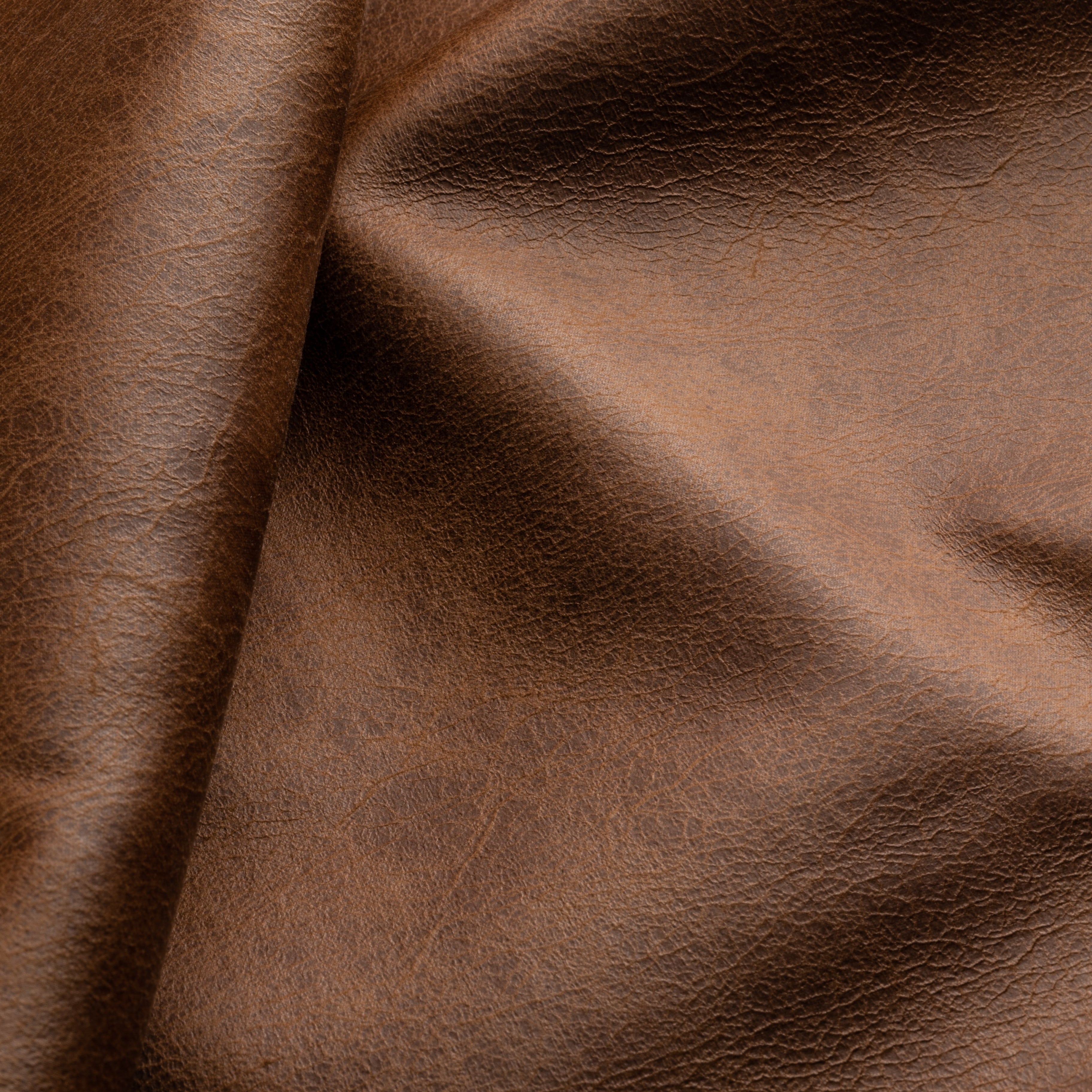 This strong vegan leather has the touch, look, and feel of a true high-end hide, making it difficult tell apart from a real one. It holds shape through daily wear, preserving a refined, high‑end appearance over time.

COMPOSITION: 100% PES
WEIGHT: 518 g/m²
MARTINDALE ABR. EP: 45k+ Rubs