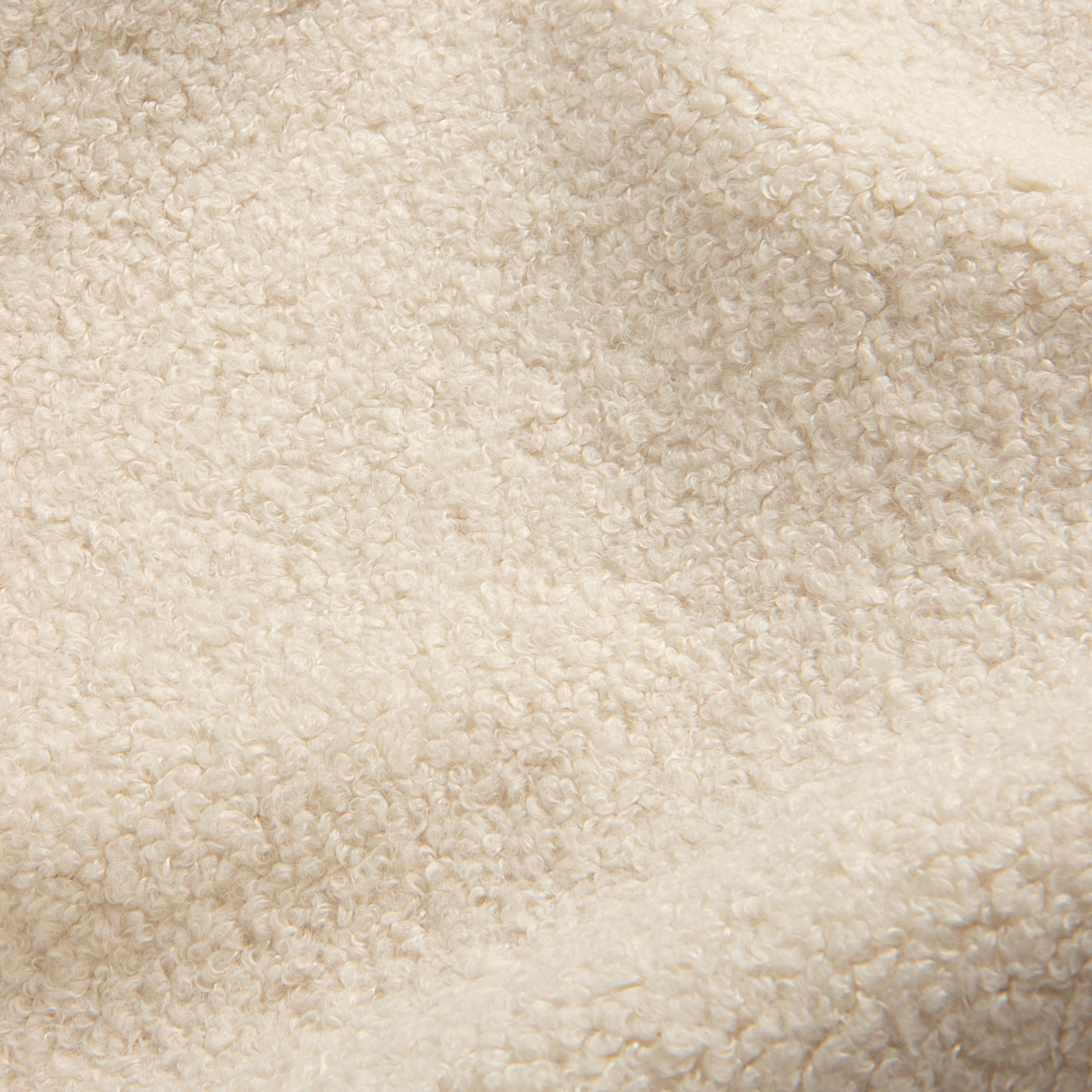 An eco-conscious faux shearling that balances exceptional softness with rugged durability. Showcasing a robust, plush pile spun entirely from recycled polyester, its deep texture authentically echoes the surface of genuine shearling while retaining a comfortably gentle hand.

COMPOSITION: 100% Recycled PES
WEIGHT: 500 g/m²
WYZENBEEK EP: 100k+ Rubs
MARTINDALE ABR. EP: 100k+ Rubs