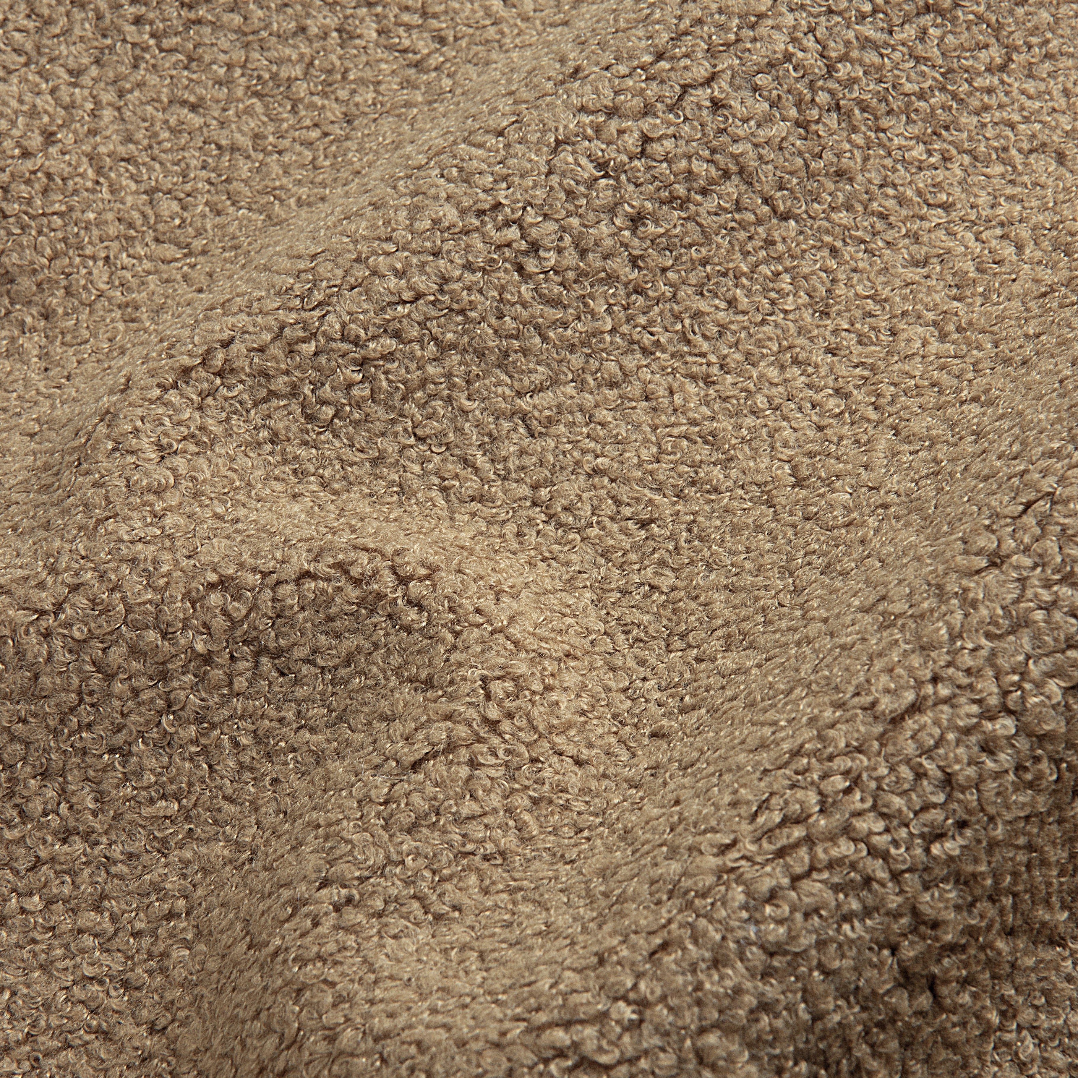 An eco-conscious faux shearling that balances exceptional softness with rugged durability. Showcasing a robust, plush pile spun entirely from recycled polyester, its deep texture authentically echoes the surface of genuine shearling while retaining a comfortably gentle hand.

COMPOSITION: 100% Recycled PES
WEIGHT: 500 g/m²
WYZENBEEK EP: 100k+ Rubs
MARTINDALE ABR. EP: 100k+ Rubs