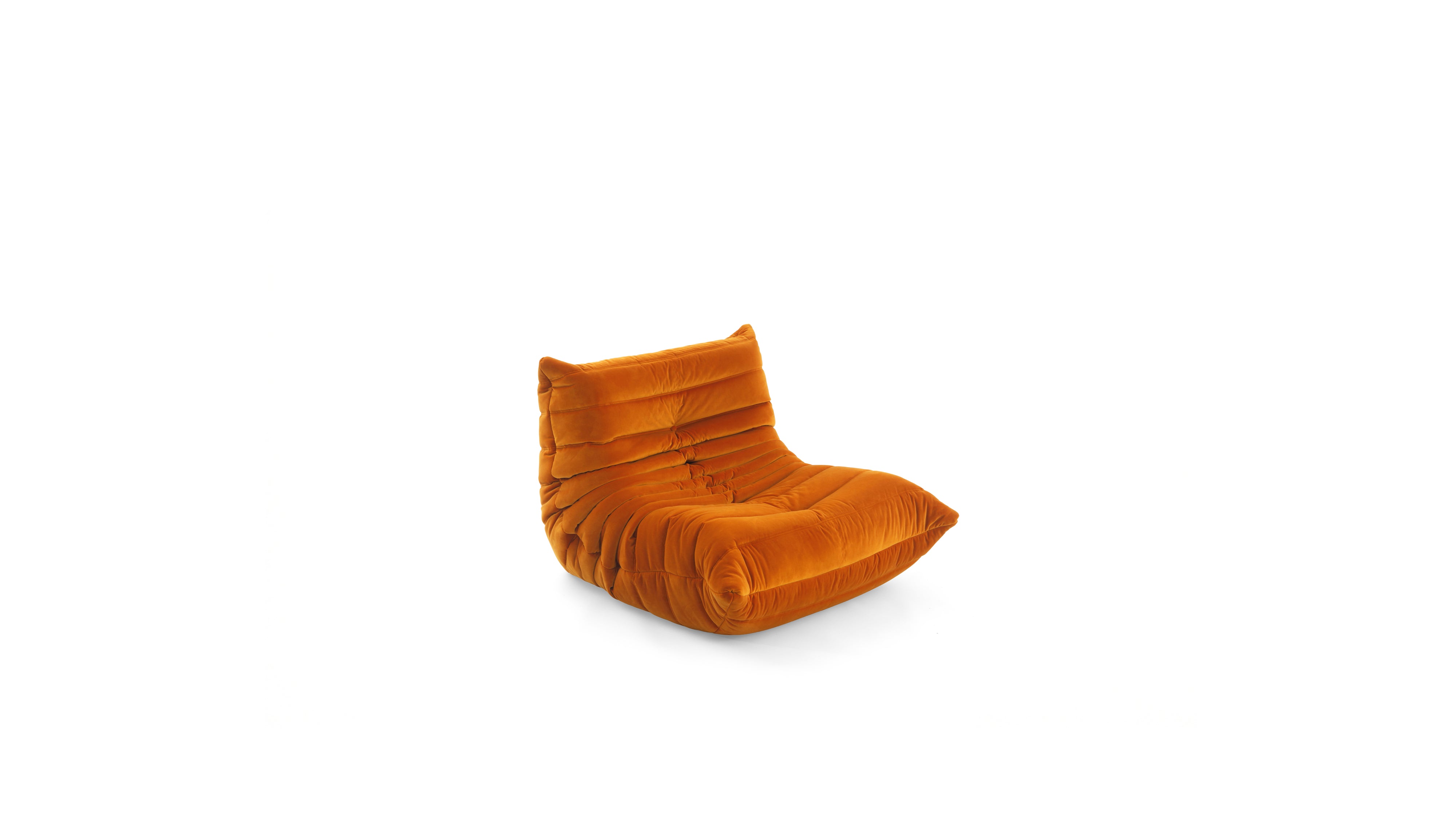 An orange velvet TOGO Fireside lounge chair with a high, cushioned backrest, shown on a plain white background.